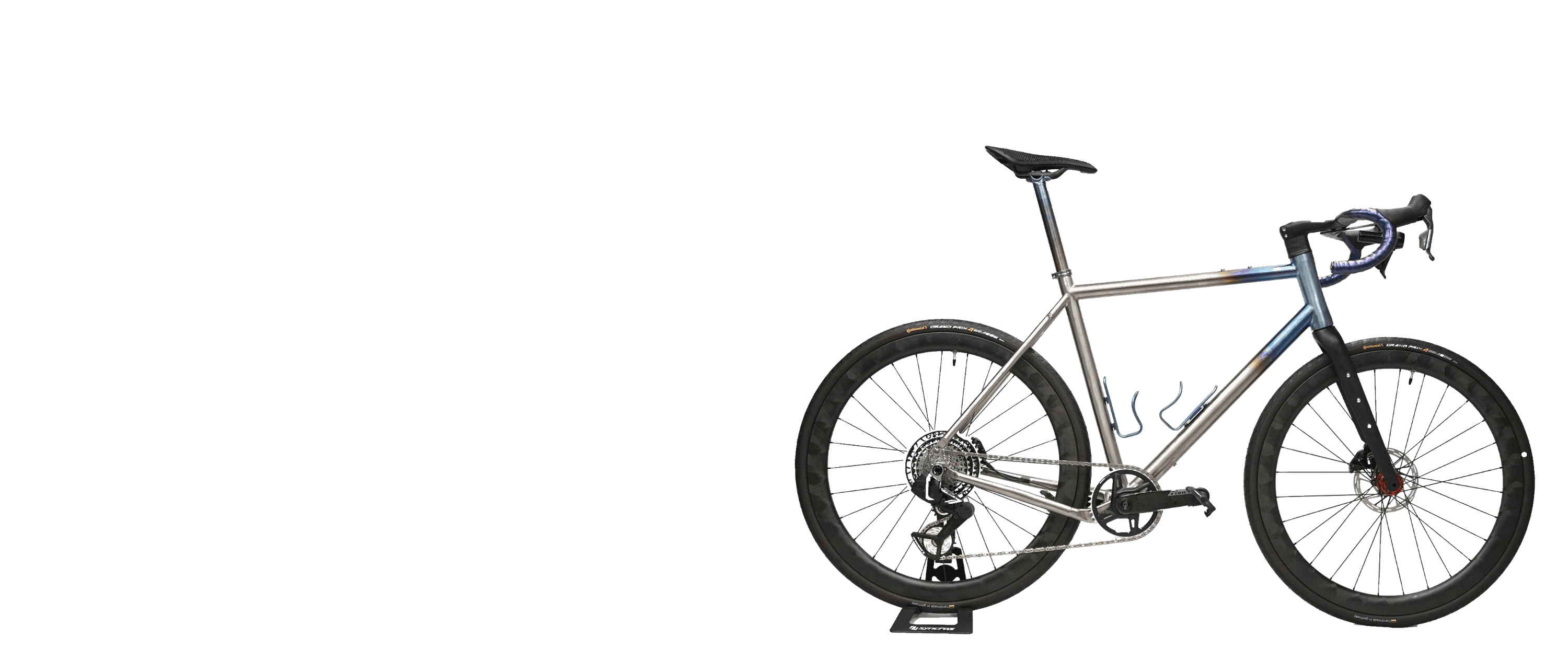 Hand-welded titanium frame on workshop stand